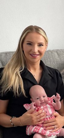 Image of the patient Charlotte and baby Poppy now back at home