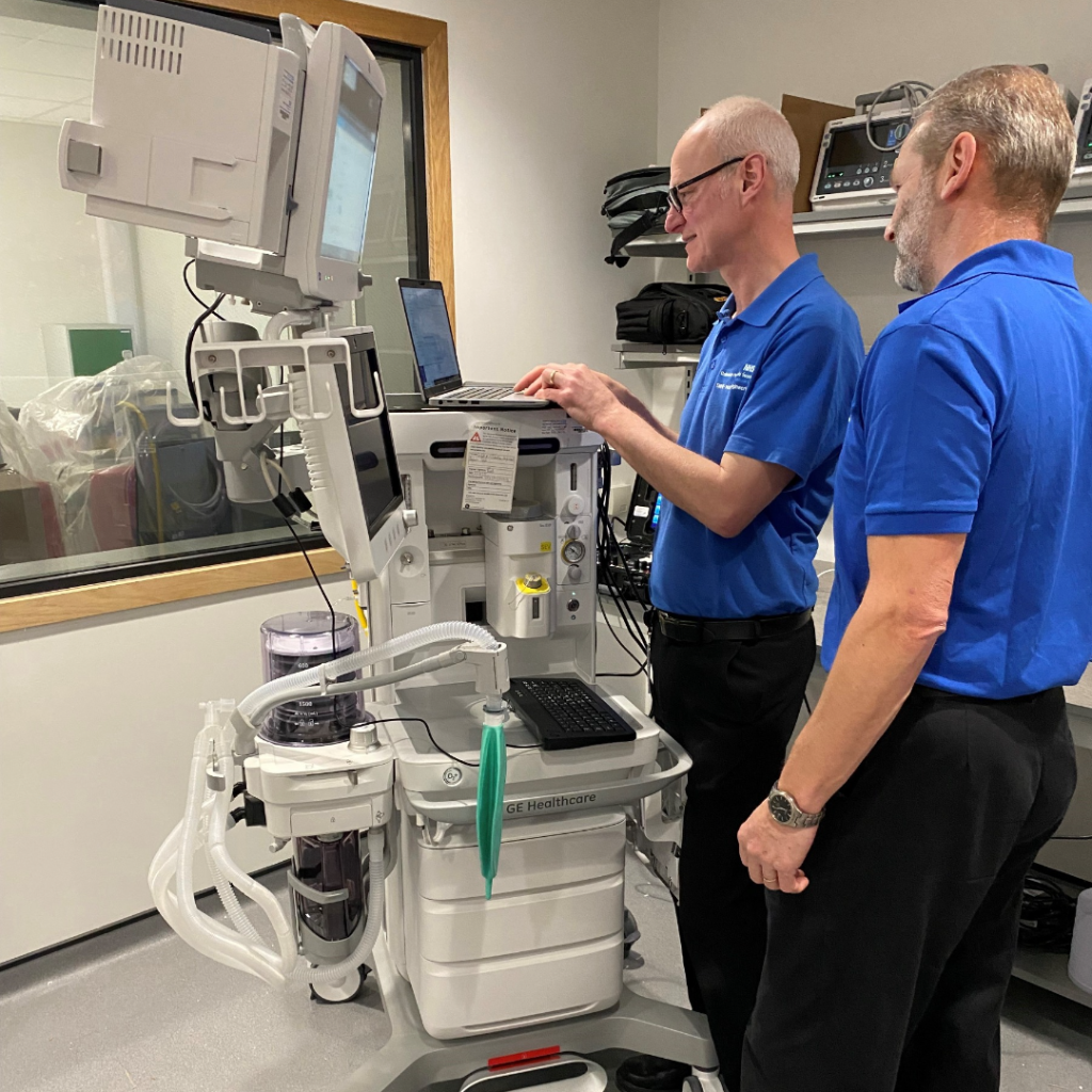 Clinical engineers using hospital technology