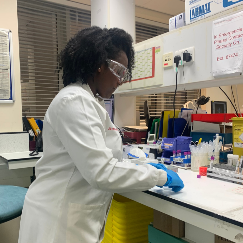 Jessica, a Trainee Biomedical Scientist examining samples in the lab