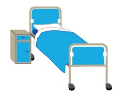 A hospital bed and bedside cabinet.