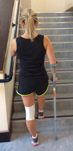 Going upstairs using a crutch