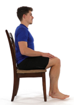 Sitting in a chair. Fully straighten your leg.