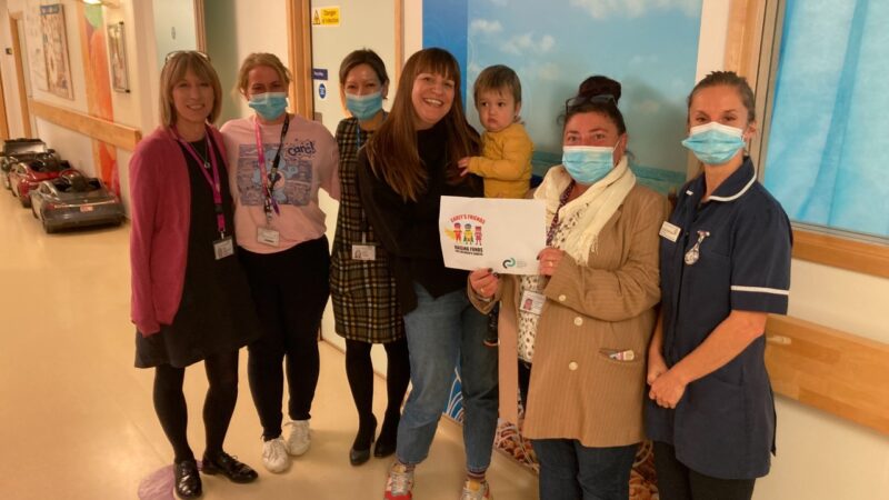 Carey and Naomi Austin with some of the medical team involved in his care at The Alex