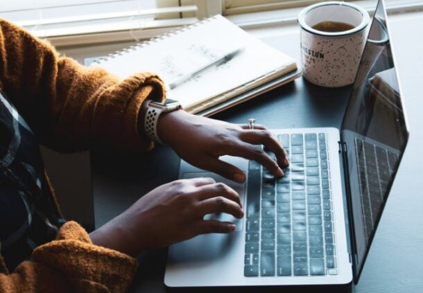 person hand using laptop