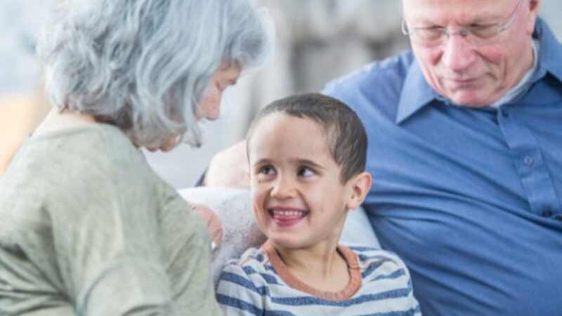 Elderly couple with grandchild