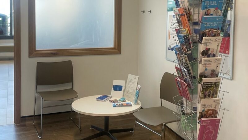 Photo showing the health information point display stand and table and chair